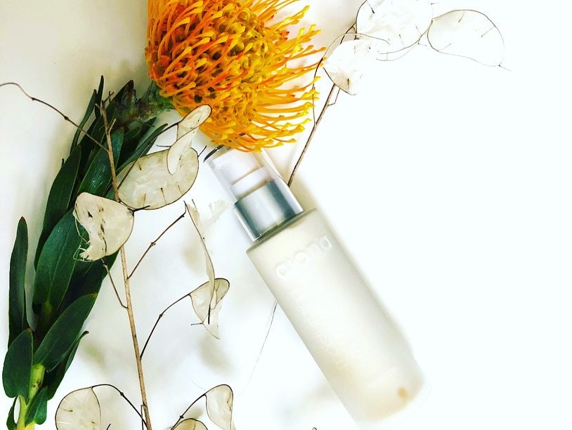 glass bottle moisturizer with flowers