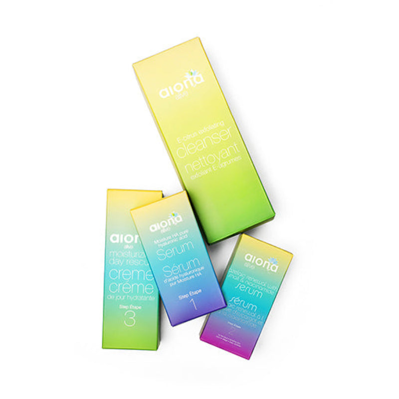 Gradient-colored skincare product boxes with 'alora' branding on a white background