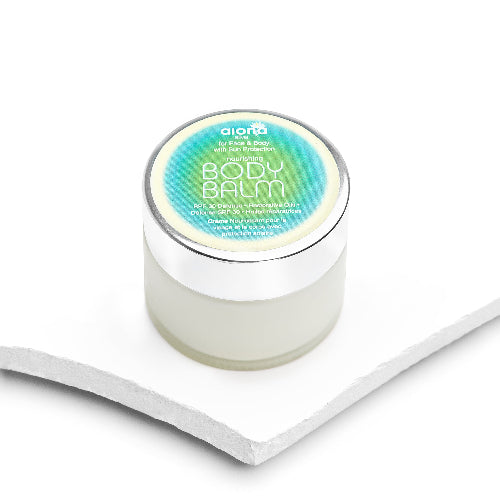 Jar of body balm with a blue label on a white background